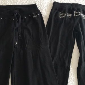Two pairs of Bebe black yoga pants